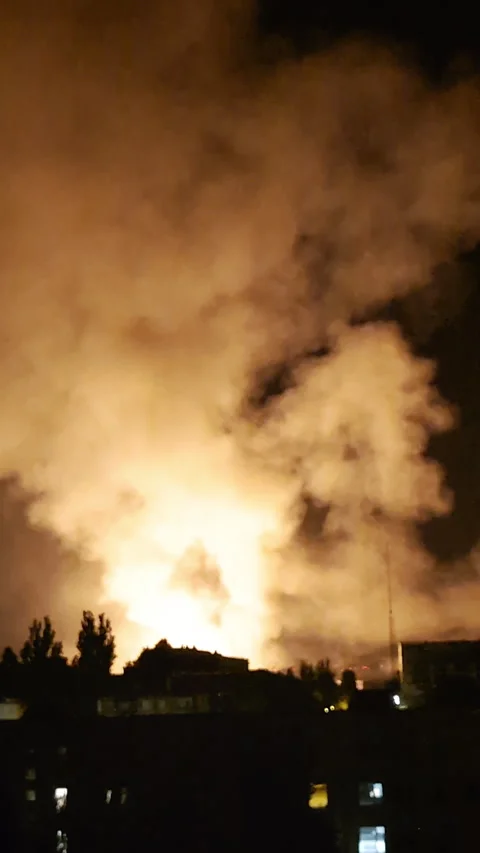 Explosion and fire at night with visible smoke and drone sounds Stock Footage 312415064