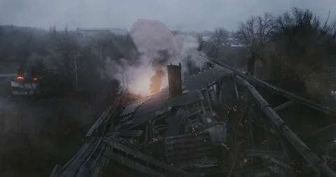 Explosion of an artillery shell from falling into an abandoned building Video stock 153625803