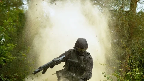 Explosion behind soldier, slow motion Stock Footage 86457984