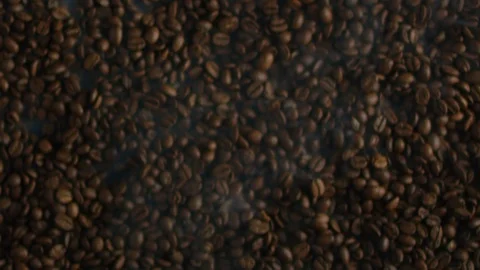 Explosion of black coffee beans, making espresso coffee in slow motion Video stock 118709443