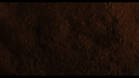 Explosion of black ground coffee , making espresso coffee in slow motion Video stock 118656617