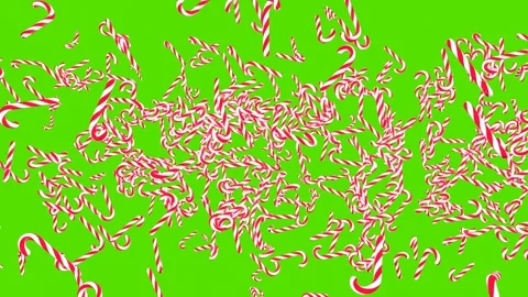 An explosion of classic candy canes on a green screen. Flying lollipops. Stock Footage 274080739