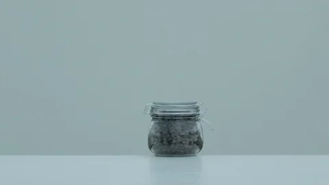 Explosion of a coffee bean jar, Ultra Slow Motion Video stock 86578475