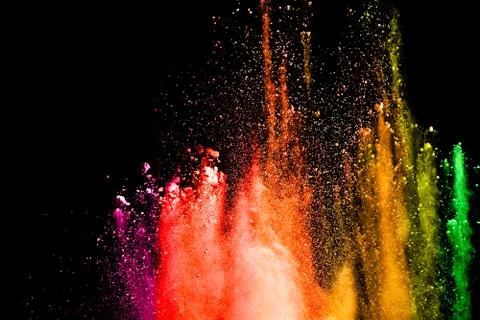 Explosion of colored powder on black background. Stock Illustration