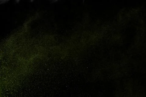 Explosion of colored powder on black background, Colorful dust explode. Holi Stock Photos