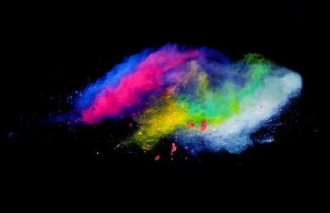Explosion of colored powder on black background Stock Photos