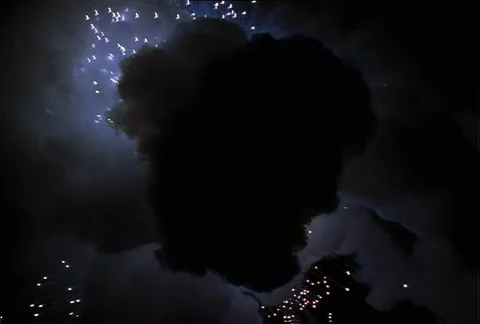 Explosion with comets and advancing black cloud Stock Footage 86914815