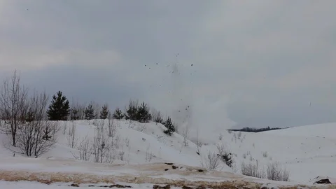 Explosion of dynamite in the winter in the snow on a hill Stock-Footage 104728422