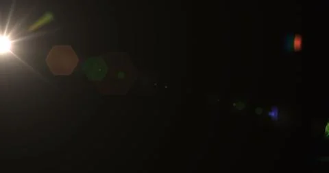 Explosion of the flash light in the lens. Lamp rays lighting in dynamic. Bright Stock Photos
