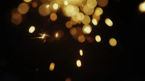 Explosion gold lights sparkles. Glowing light explodes. slow motion shot Stock Footage 195996691