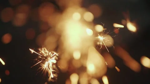 Explosion gold lights sparkles. Glowing light explodes, Slow motion shot Stock Footage 208398882