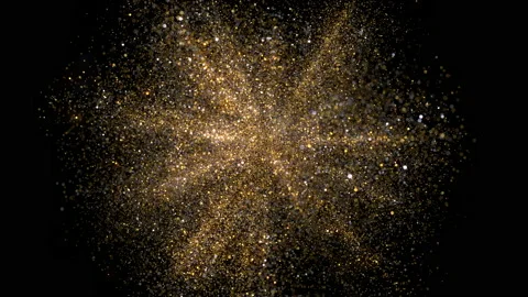 Explosion of golden dust Stock Footage 134552081