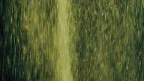 Explosion of Golden Glitter Particles on Black Background Slow Motion Video stock 147606974