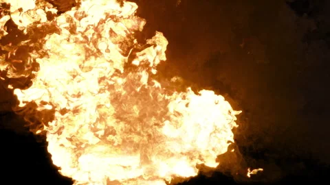 An explosion with a large release of heat, a fire on a black background Stock Footage 274259983