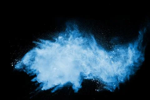 The explosion of multi colored powder. Beautiful rainbow color powder fly. Stock Photos