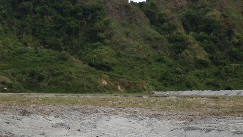 Explosion in an open field below a mountain 1 Stock Footage 106511207