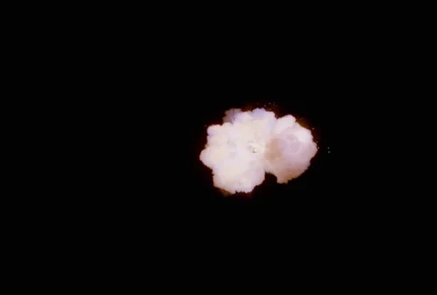 Explosion puffing out multicolored smoke cloud Stock Footage 86915155