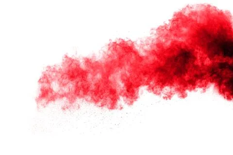 The explosion of red colored powder. Beautiful powder fly away. Stock Photos