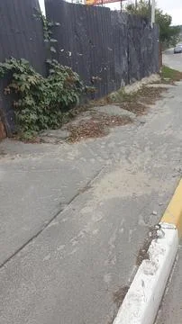 An explosion from a shell on the sidewalk Stock Photos