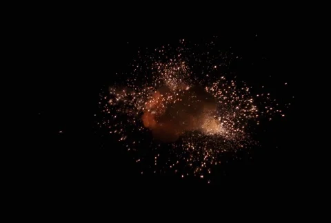 Explosion with shower of sparks falling toward viewer Stock Footage 86914762