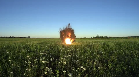 Explosion of small-caliber projectile on the field in summer Sunny day. Stock Footage 66201106