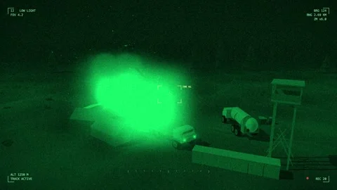 Explosion on supply depot through a night vision sight 库存影片 342333376