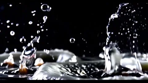 Explosion of water droplets into the camera in slow motion Stockbeeldmateriaal 305633780