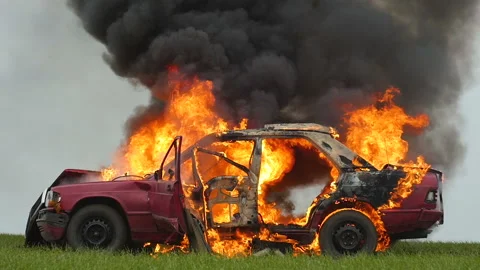 Explosion Wheel In Slow Motion. Wheel Burns In Burning Car. Side View. Stock Footage 98649174