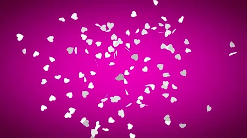 Explosion of white hearts on a dark pink background. Heart confetti. Stock Footage 226419481