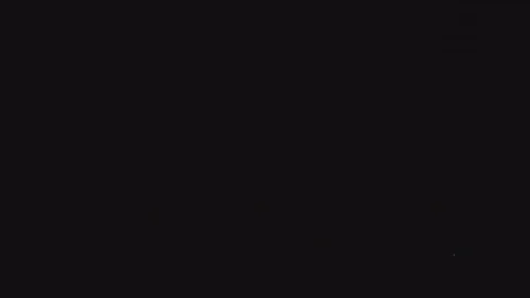 Explosions of colored fireworks in dark sky Stock Footage 82370489