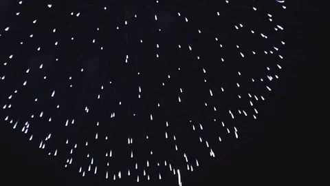Explosions of colored fireworks in the dark sky Stock Footage 82370490