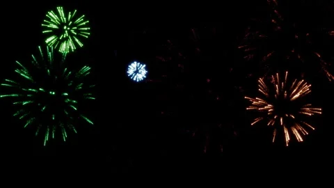 Explosions of multi-colored festive fireworks in the dark sky 2 Stock Footage 283087163