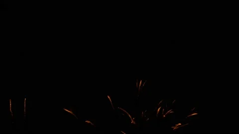 Explosions of multicolored fireworks against dark night sky. Stock Footage 222623009