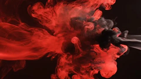 Explosions of Red Smoke Creating a Dramatic Dance in a Dark Room Stock Footage 326846442