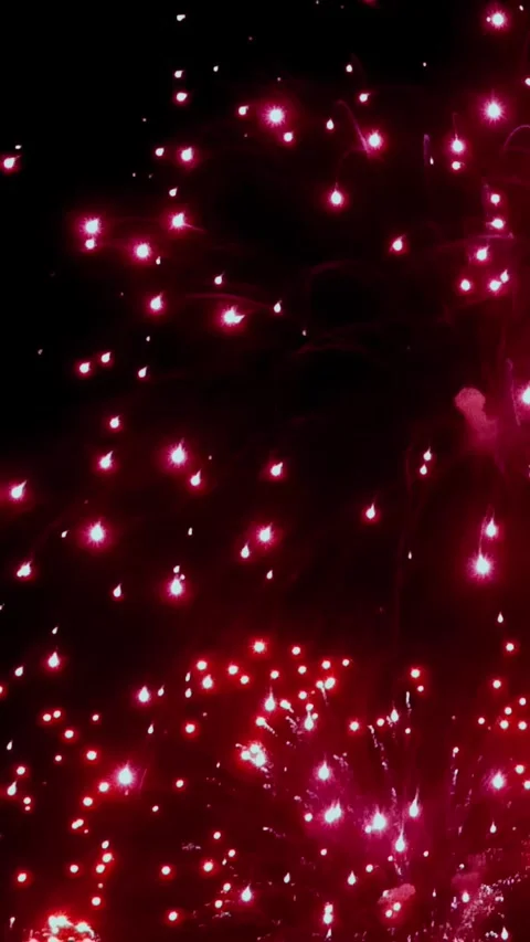 Explosions of Ruby Light Paint the Night Sky on Independence Day Stock Footage 326363842
