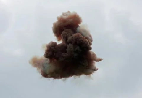 Explosions in the sky by an unidentified flying object and the smoke of the c Stock Photos