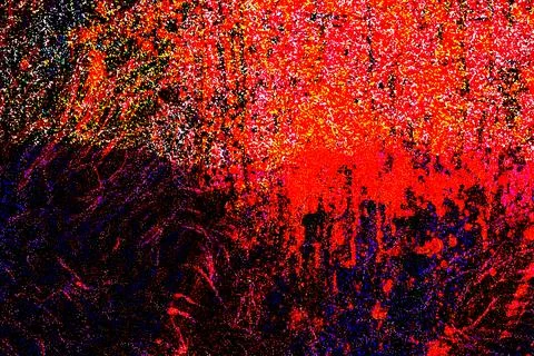 Explosive abstract texture with dominant red and black tones overlaid by speckle Stock Photos