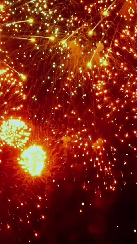 Explosive celebration lights up the night sky with vibrant colors and joy 스톡 동영상 314213617