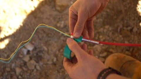 Explosive detonator being connected to C... | Stock Video | Pond5