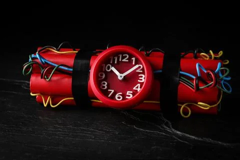 Explosive dynamite time bomb on black background Stock Photos