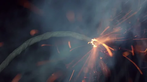 Explosive fuse ignited by a burning match Stock Footage 58485847
