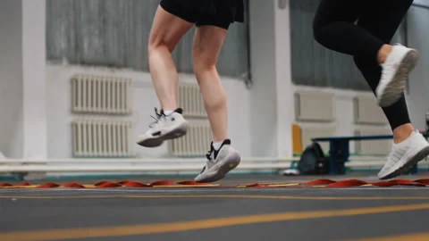 Explosive movement on agility ladder. Athletes perform quick sprints and jumps Stock Footage 335951035