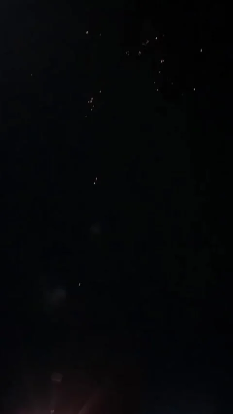 Explosive Night: Fireworks Display Illuminates Dark Sky with Vibrant Bursts Stock Footage 313482666