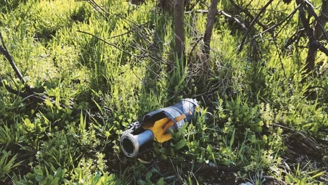 Explosive objects - shells, rockets, mines, cartridges, bullets are lying in the Stock Footage 237531521
