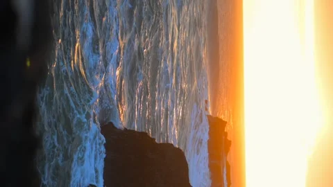 Explosive splashes at Golden Hour Seascape. Vertical video Stock Footage 316203784