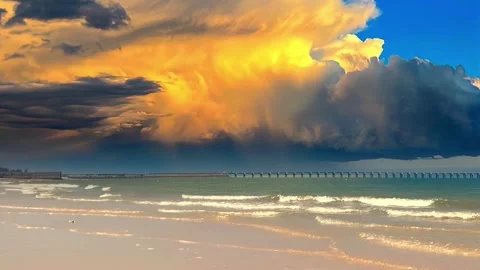Explosive Storm Clouds Over a Coastal Jetty and Sandy Beach Shore Vídeo Stock 320040587