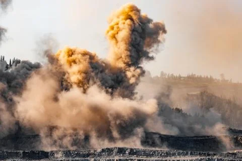 Explosive works on open pit coal mine industry Stock Photos