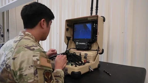 Explosives Ordnance Disposal technician operating Multi-Mission Robotics System Stockbeeldmateriaal 209546839