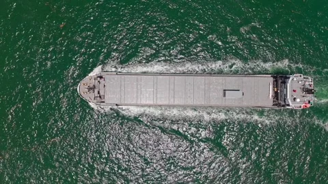 Export and import. Cargo business. Empty barge. Cargo ship with container at sea Stock Footage 314281377
