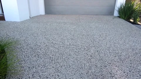 Exposed Aggregate concrete surface driveway of a new modern house Stock Footage 275502253